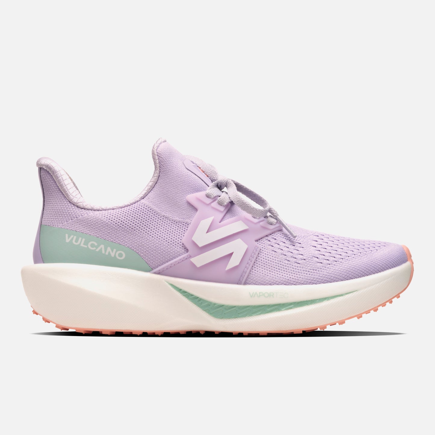 Zapatillas Mujer Magma Lila Vulcano con diseño deportivo, tecnología VaporTec y suela gruesa para running. Color lila con detalles en verde y coral.