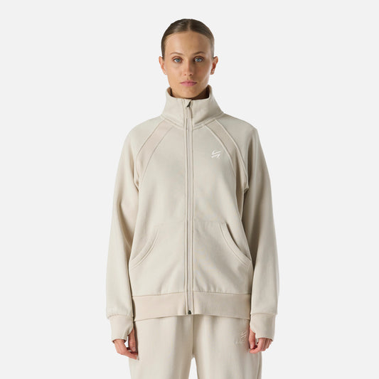 Polerón Mujer Cool Down Full Zip Sweatshirt Crema Vulcano con cierre completo y cuello alto, ideal para invierno y estilo lifestyle.