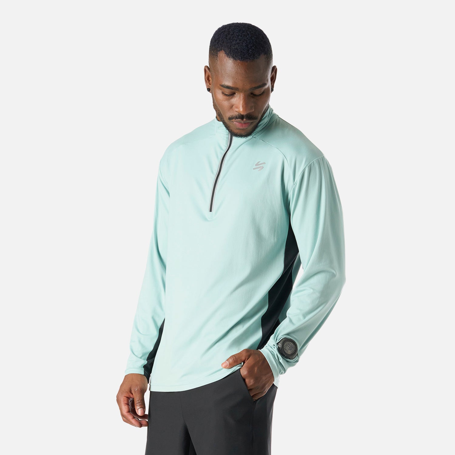Polerón Hombre Tempo 1/4 Zip Midlayer Jade Vulcano con paneles laterales oscuros y ajuste cómodo. Perfecto para actividades como pádel o running.