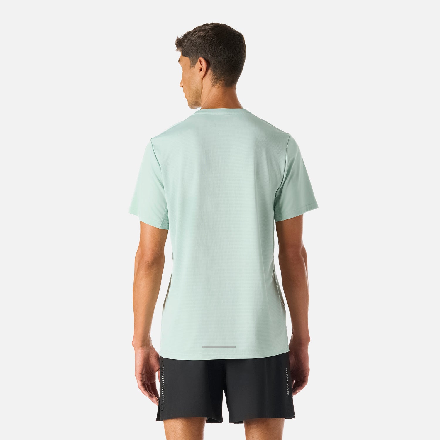 Vista trasera de la Polera Hombre Tempo Advanced T-Shirt Jade Vulcano con detalle reflectante y tejido Q-Dry para mayor frescura durante el ejercicio.