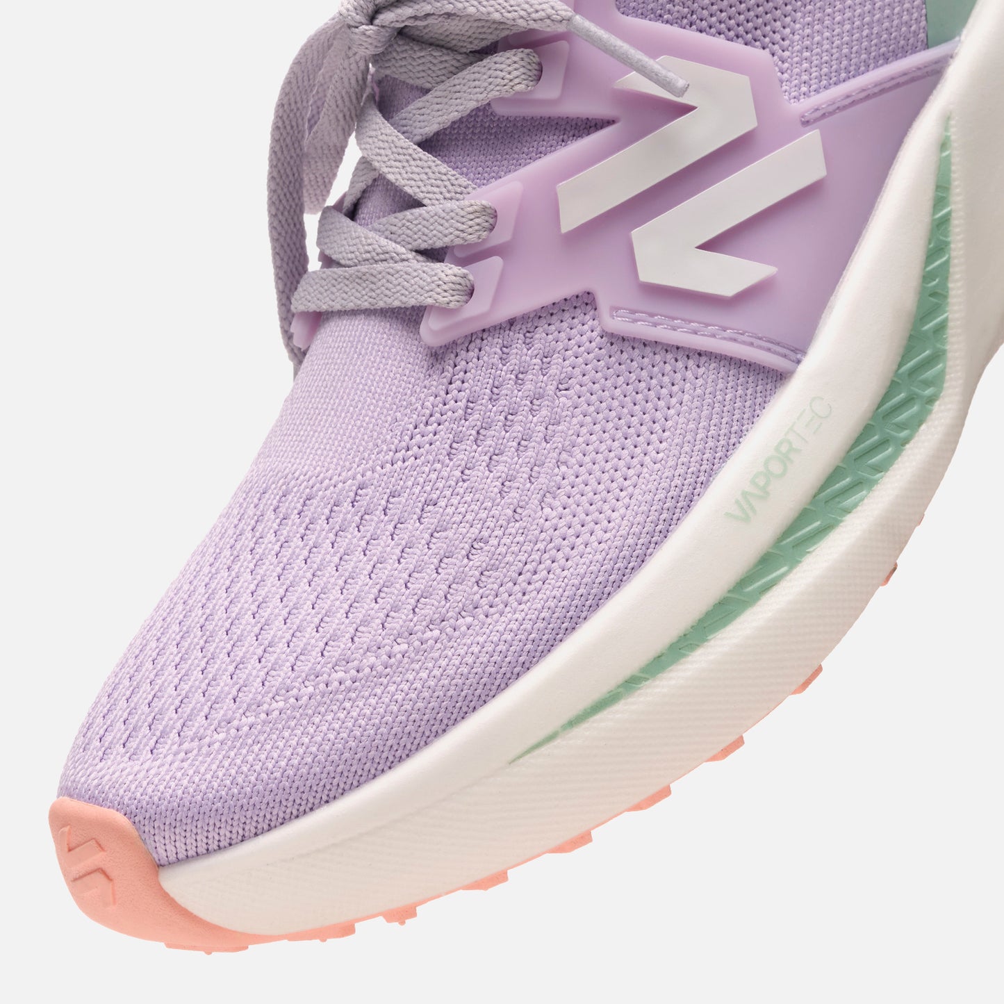 Detalle frontal de las Zapatillas Mujer Magma Lila Vulcano mostrando la malla transpirable y tecnología VaporTec. Diseño ligero y flexible.