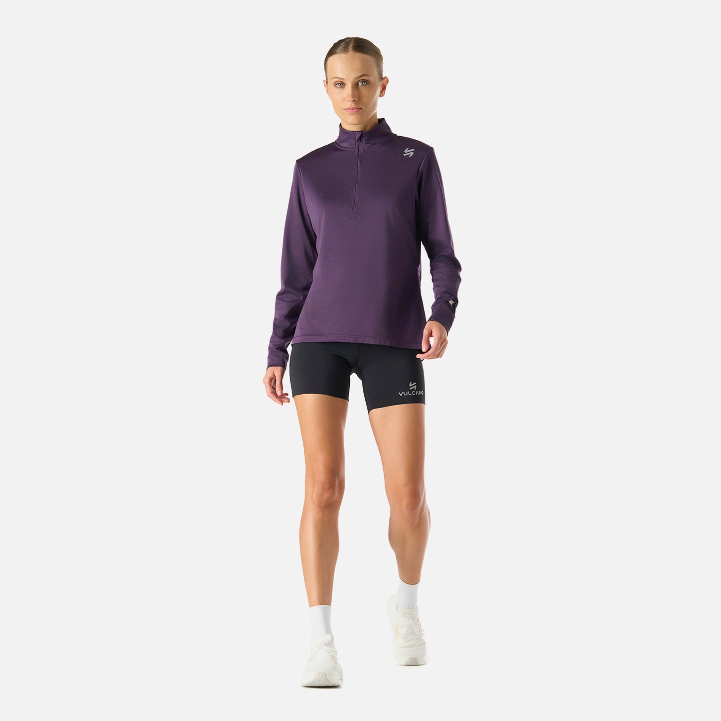 Polerón Mujer Built To Move 1/4 Zip Midlayer Morado Oscuro Vulcano en look deportivo completo, ideal para entrenamiento y running.