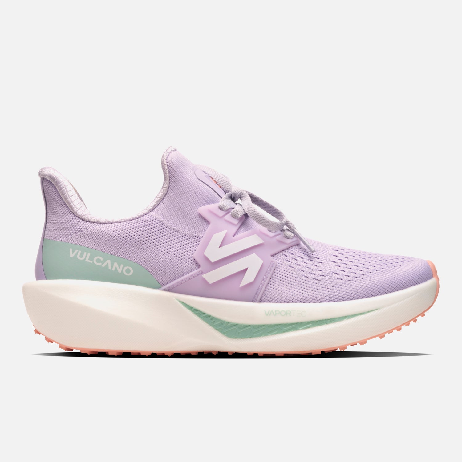 Zapatillas Mujer Magma Lila Vulcano con diseño deportivo, tecnología VaporTec y suela gruesa para running. Color lila con detalles en verde y coral.