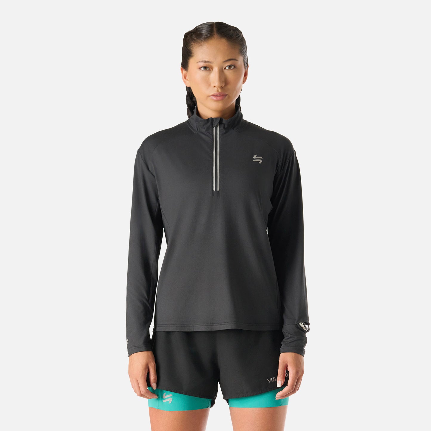 Polerón Mujer Tempo 1/4 Zip Midlayer Negro Vulcano con cierre frontal y diseño deportivo, ideal para running y training en invierno 2025.