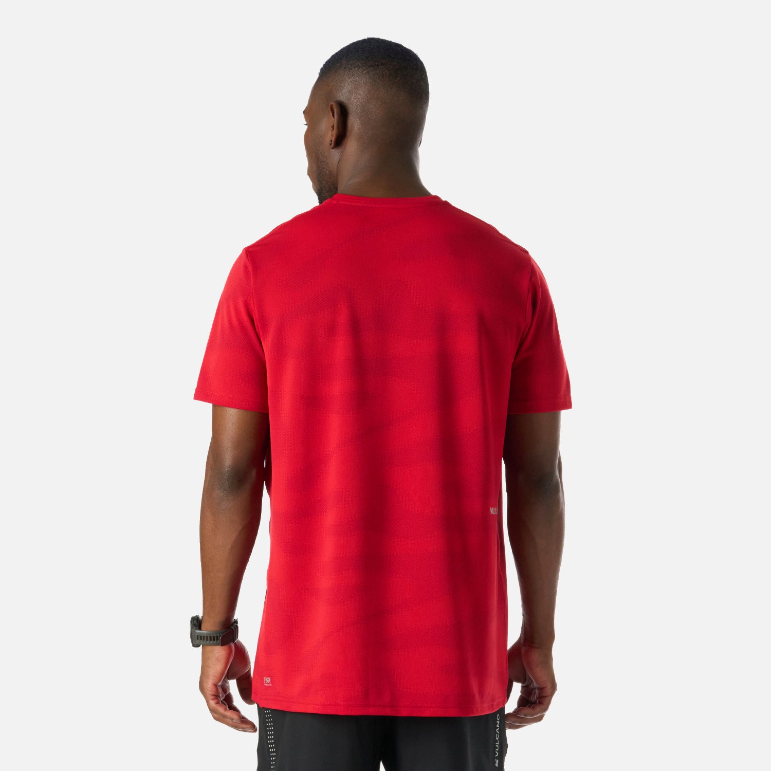 Vista trasera de la Polera Hombre Built To Move Pro T-Shirt Anaranjado Vulcano, con patrón texturizado y ajuste relajado para mayor comodidad.